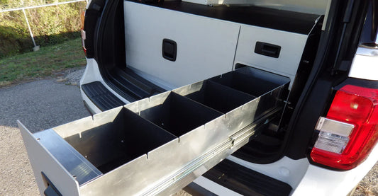 One large left drawer with two small drawers on the right, designed for rear cargo storage in a Ford Expedition emergency response vehicle, ensuring organized and accessible equipment storage.
