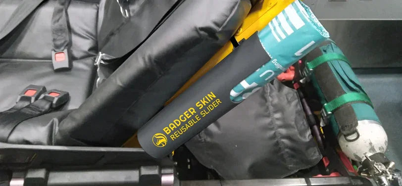 Badger Skin M1 slider in a custom holster to store slider on stretcher