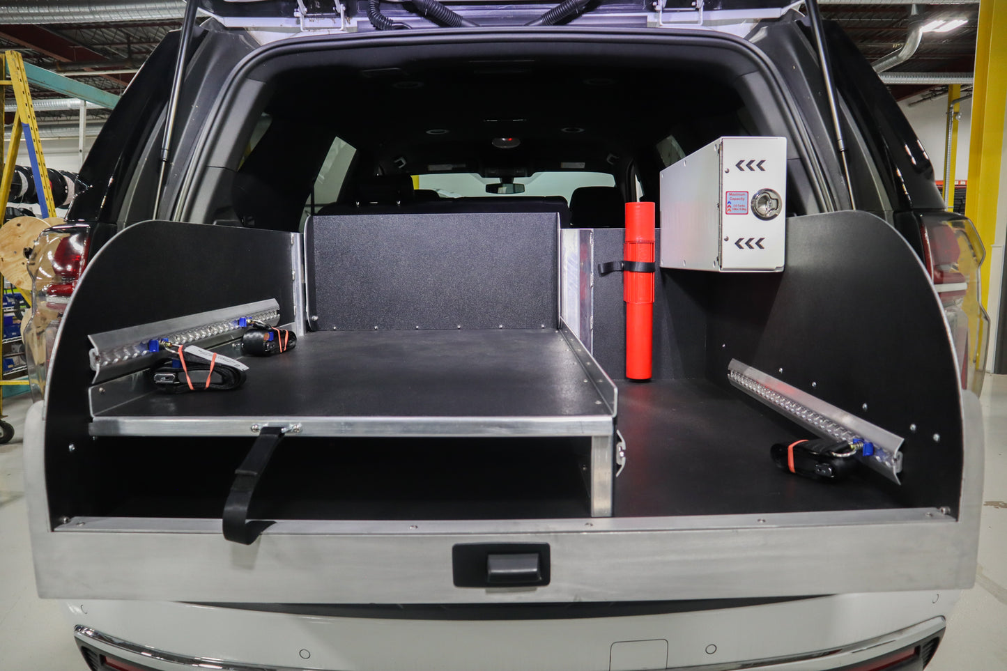 Rear storage system installed in a Chevrolet Tahoe emergency response vehicle.