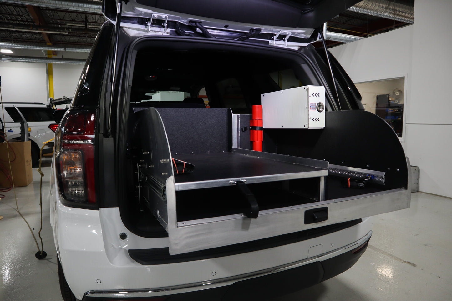 Extended view of Chevrolet Tahoe rear storage system.