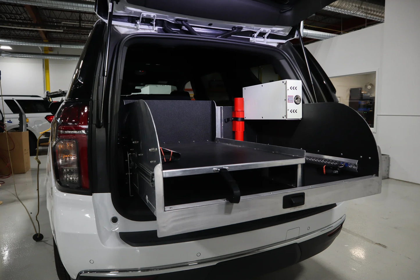 Extended view of Chevrolet Tahoe rear storage system.