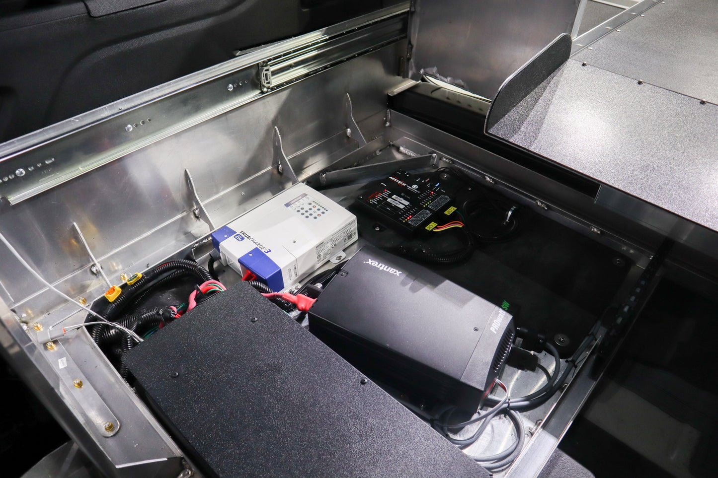 Recessed equipment area in a Chevrolet Tahoe ERV storage system.