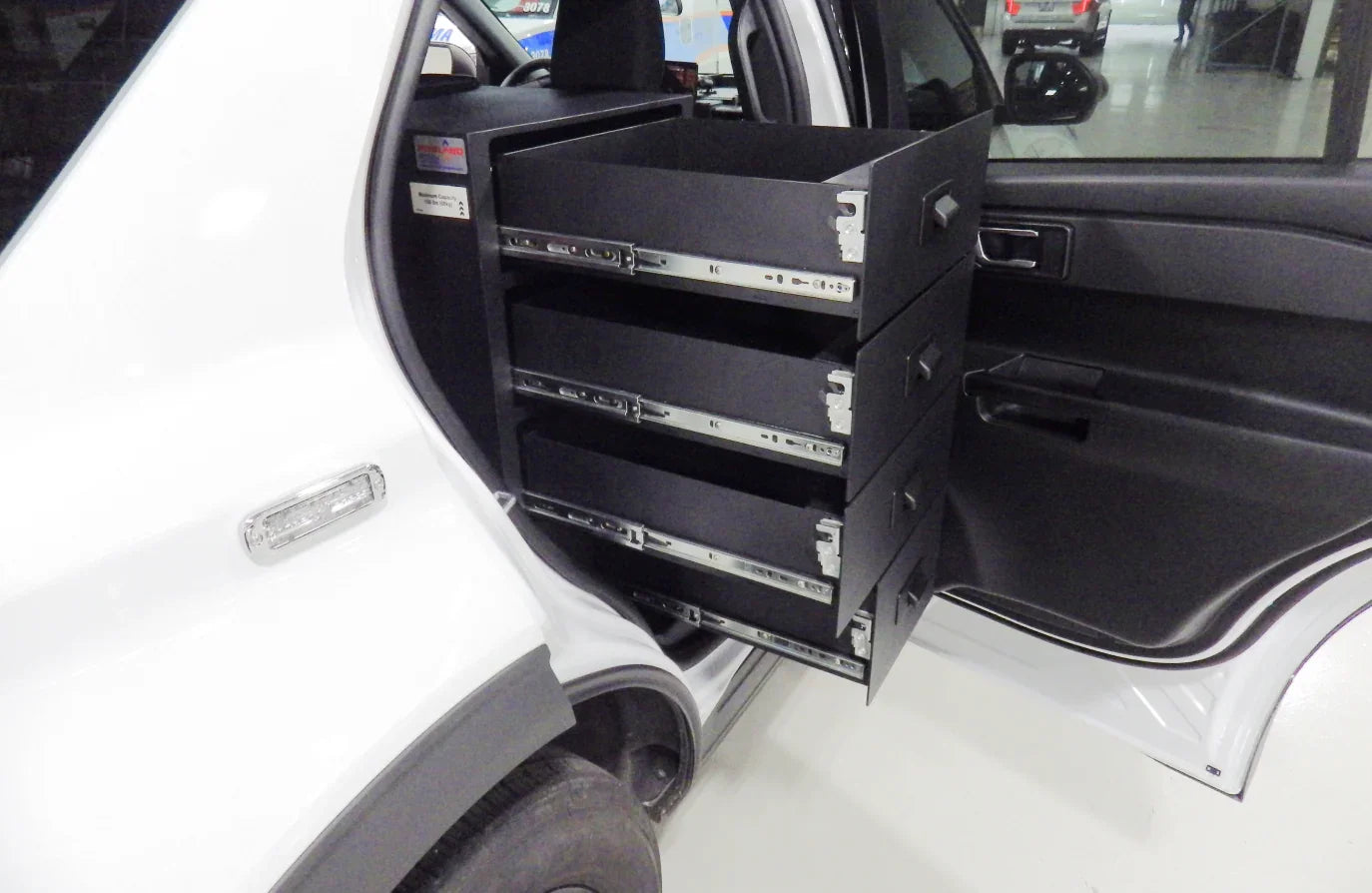 Centered and right-side storage solution with four drawers for the Ford Explorer, designed for efficient organization and easy access.