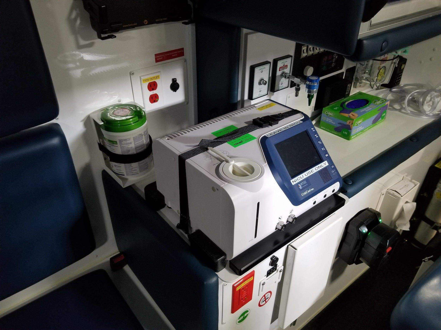 Custom mount for Criti-Cool unit in vehicle by Rowland Emergency, ensuring secure attachment and easy access during patient transport.