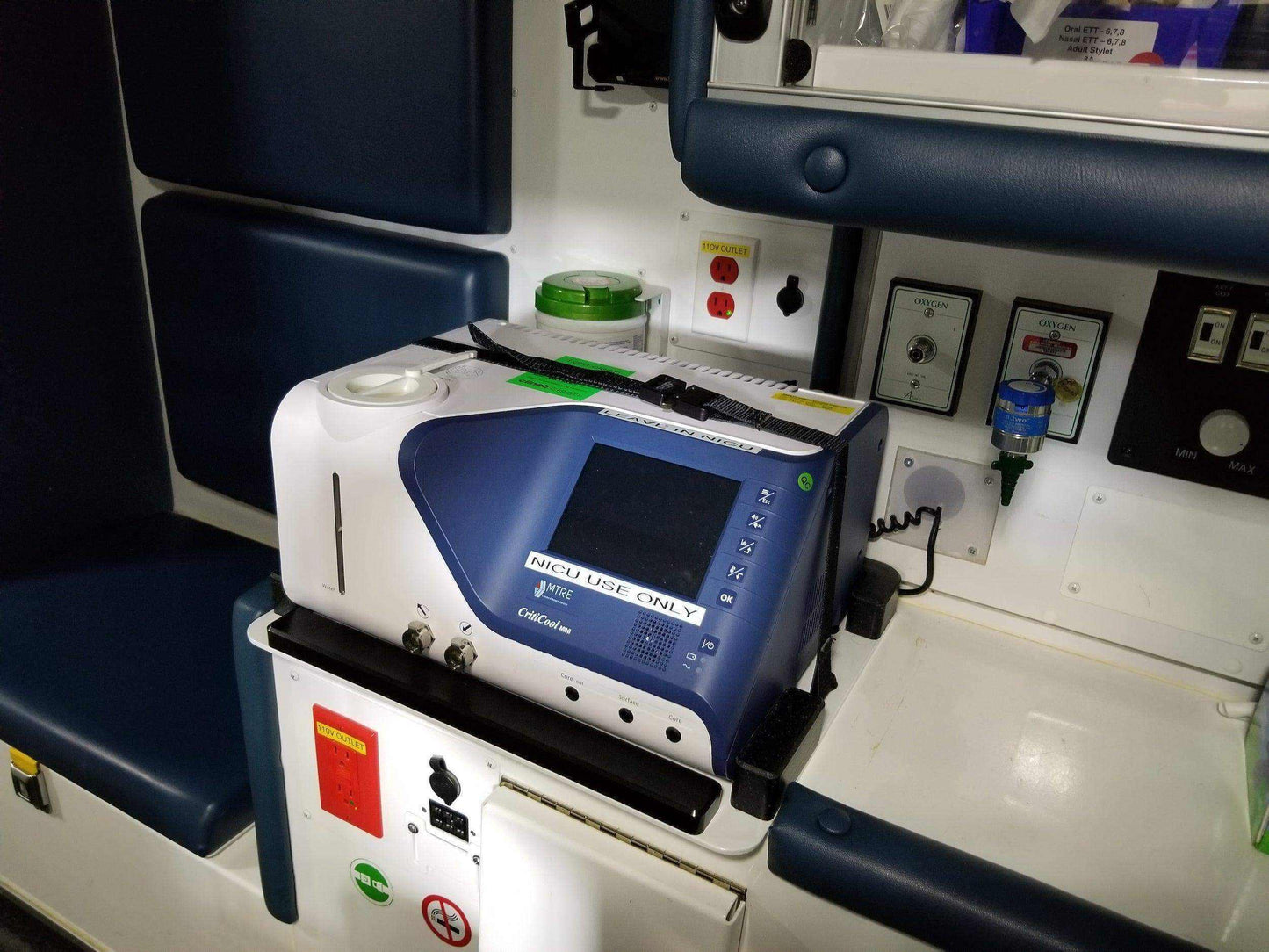 Custom mount for Criti-Cool unit in vehicle by Rowland Emergency, ensuring secure attachment and easy access during patient transport.
