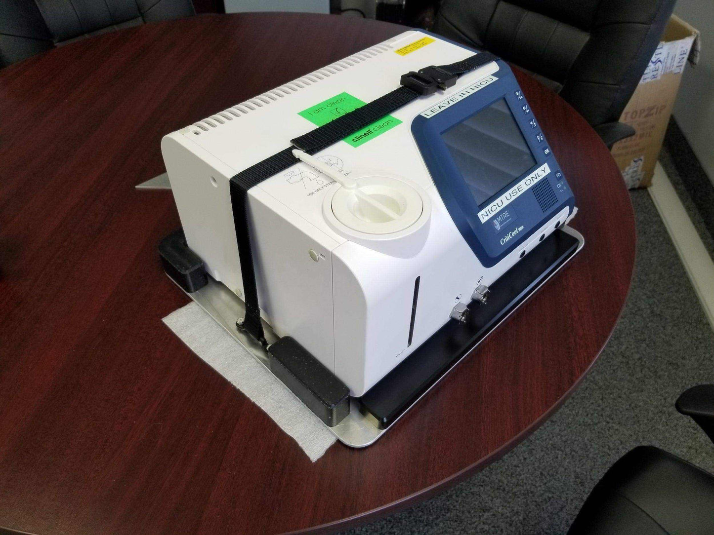 Custom mount for Criti-Cool unit in vehicle by Rowland Emergency, ensuring secure attachment and easy access during patient transport.
