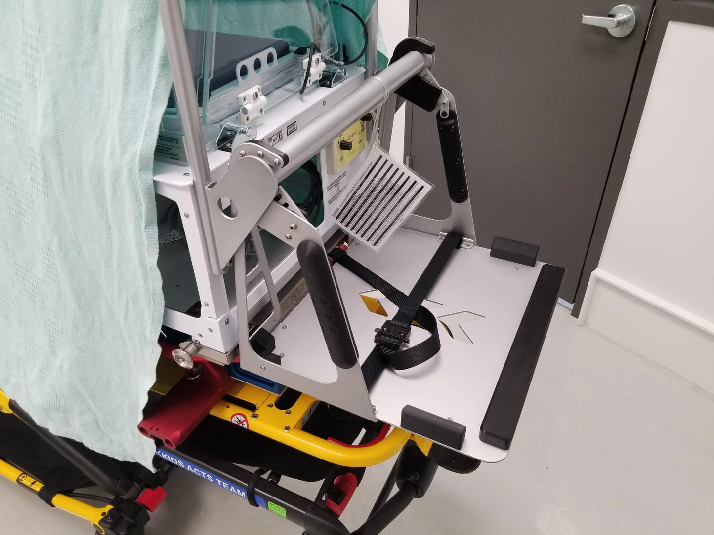 Custom mount for Criti-Cool unit on an incubator (International Biomedical, Voyager Transport Incubator) by Rowland Emergency, designed for secure and efficient installation.