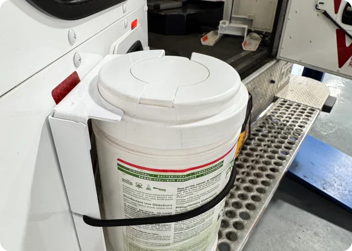 Disinfectant wipe bracket with PREempt surface cleaning wipes mounted in bracket.
