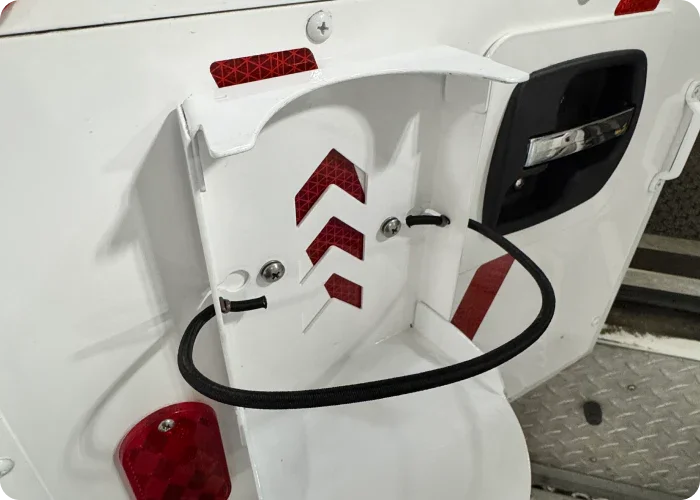 Rowland Emergency's disinfectant wipe bracket mounted on rear door of an ambulance.