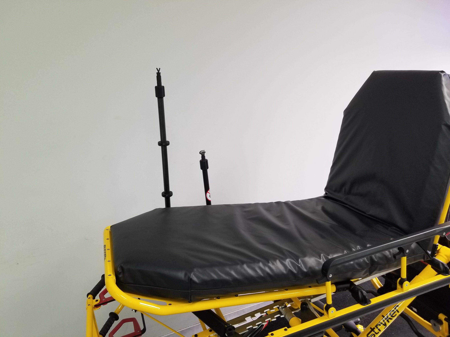 Straight equipment pole by Rowland emergency, includes an IV receptacle.