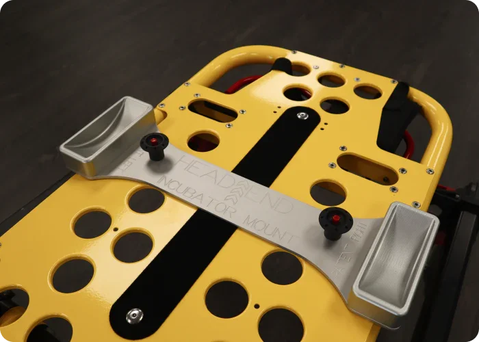 Incubator Kit with head-end wheel cups mounted on a Stryker Power-PRO XT stretcher, designed for compatibility with Ferno #9 stretchers and neonatal incubators.