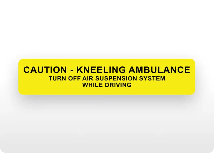 Yellow "Caution - Kneeling Ambulance" decal for emergency vehicles.