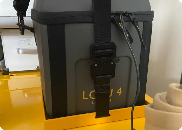 Close-up of the Laerdal unit mounted on the Stryker Power-PRO IT cot using Rowland Emergency's mounting solution, highlighting secure attachment and design details.