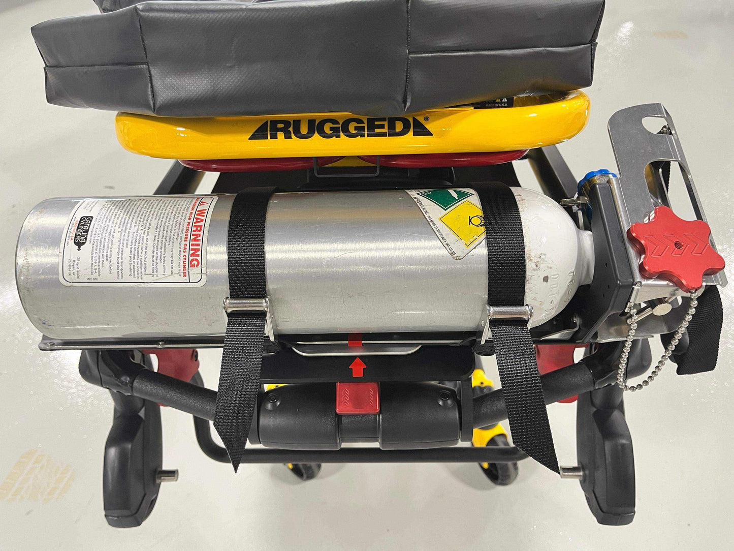 Stryker® Power-PRO XT & Power-PRO 2 cot-mounted oxygen carry kit by Rowland Emergency, designed for secure and accessible oxygen tank storage during patient transport.