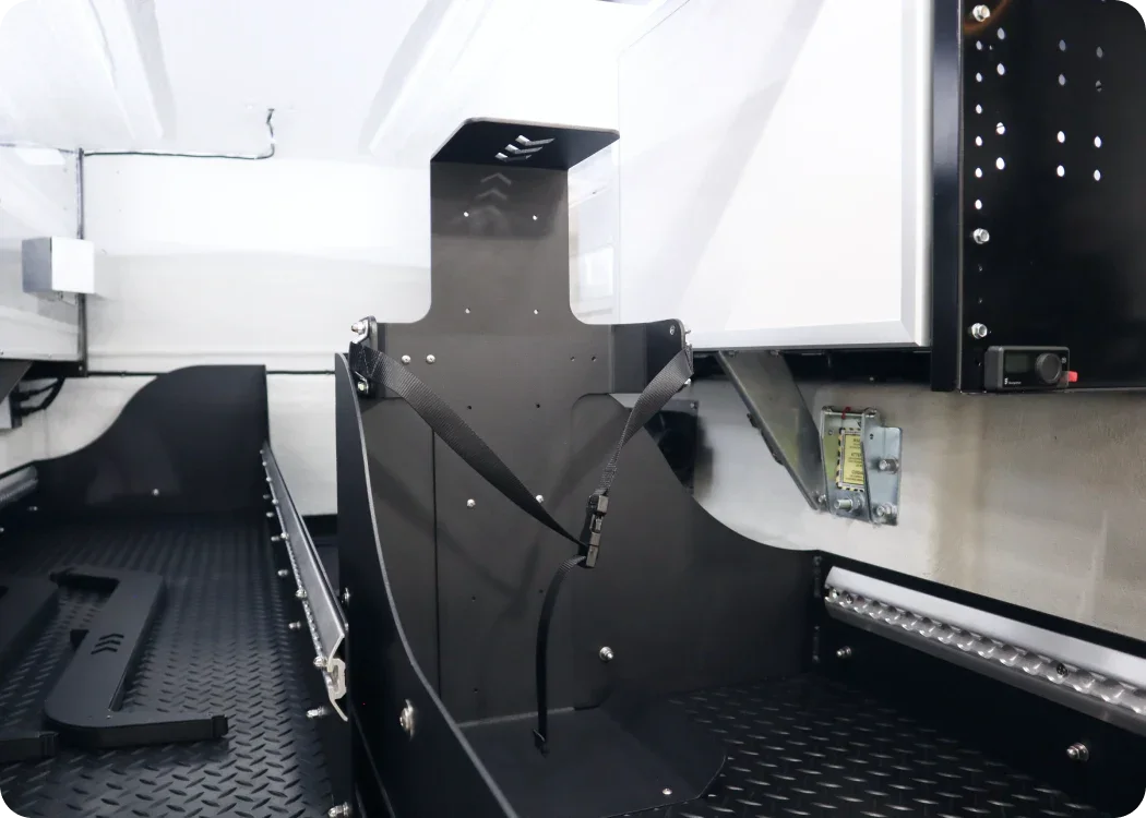 Stryker LUCAS II mounting bracket securely positioned in the rear cargo storage area of an emergency response vehicle for organized and accessible equipment storage.