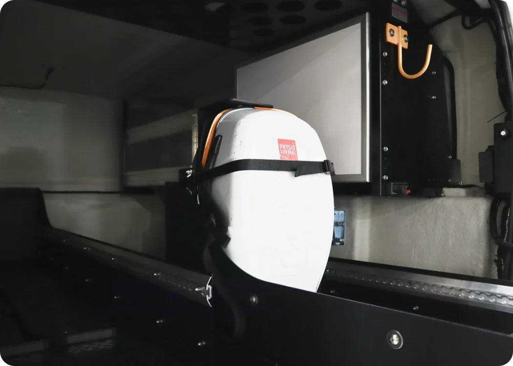Stryker LUCAS II mounting bracket with Stryker LUCAS II securely mounted and strapped in the rear cargo storage area of an emergency response vehicle.