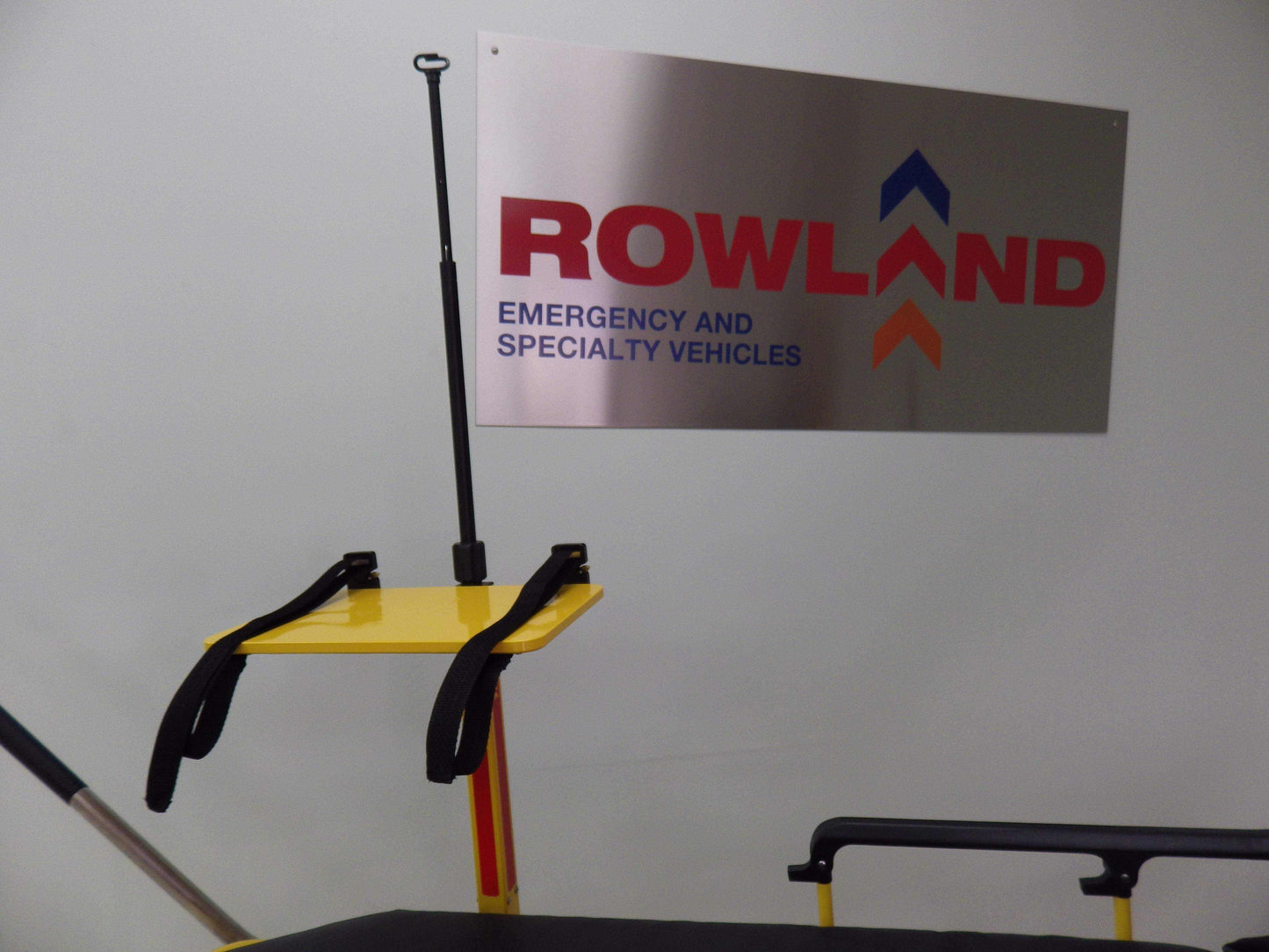 Universal defibrillator pole with IV receptacle by Rowland Emergency, designed for secure mounting and easy access to life-saving equipment.
