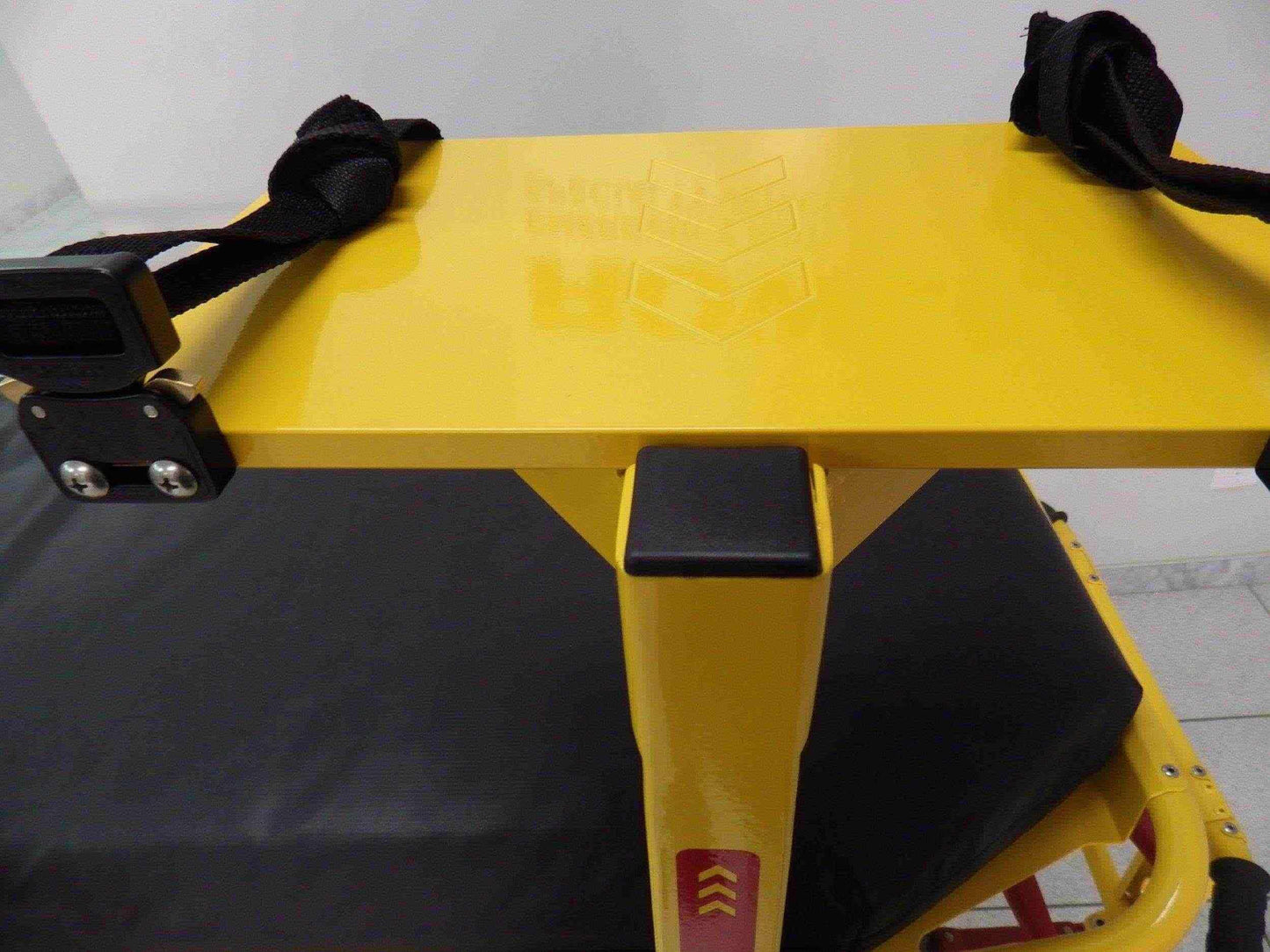Universal defibrillator pole with no IV receptacle by Rowland Emergency, providing secure mounting and easy access to the defibrillator.
