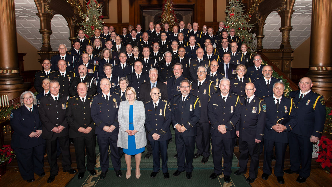 Large group of Ontario paramedics in formal uniforms posing for an award ceremony, Rowland Emergency