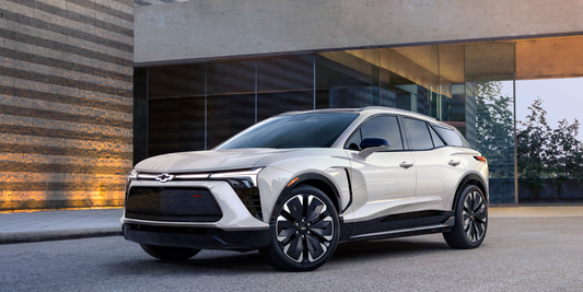 Chevrolet Blazer all-electric SSV parked in front of modern glass building, Rowland Emergency EMS vehicle solution