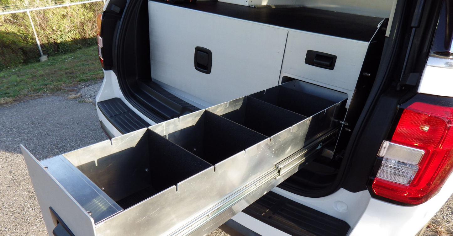 One Large Left Drawer with Two Small Drawers on the Right for Rear Cargo Storage on a Ford Expedition Emergency Response Vehicle