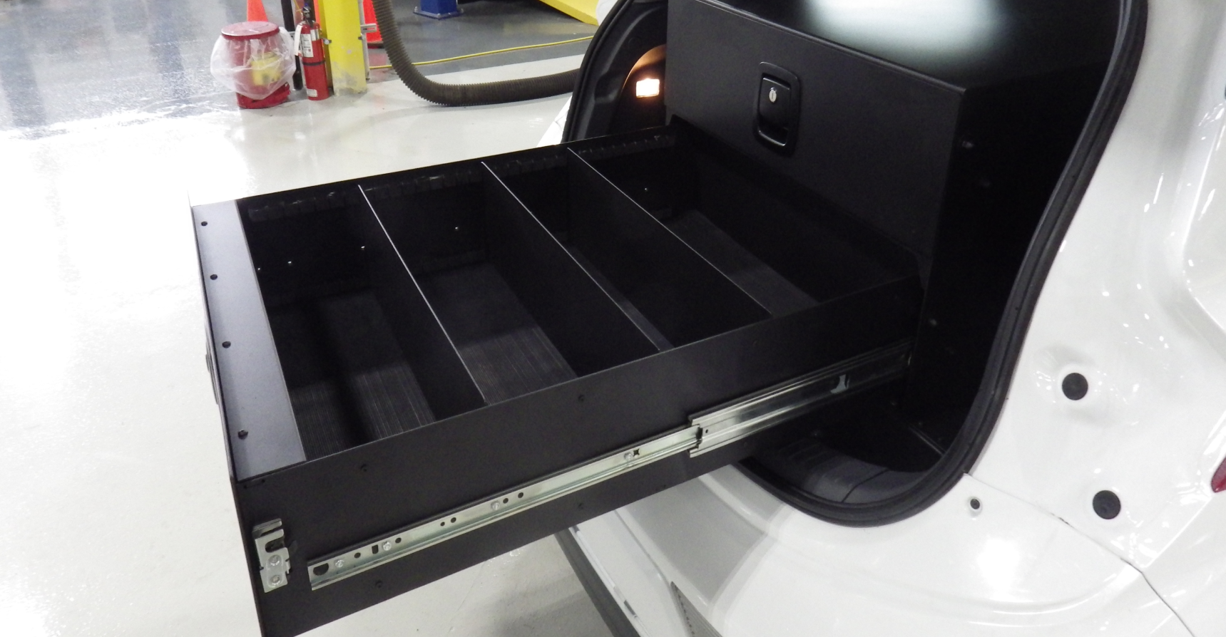 Two-drawer system for the cargo compartment of a Chevrolet Bolt, designed for organized and secure storage of equipment.