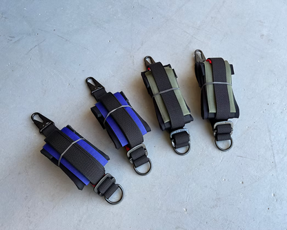 Four XDcuff REF115C straps on a light gray surface