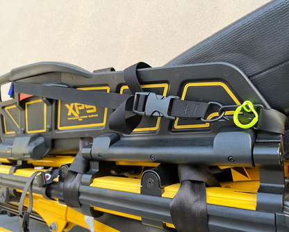 Close-up of a XPS side rail with an XDcuff REF117C strap and a yellow accent on a light background