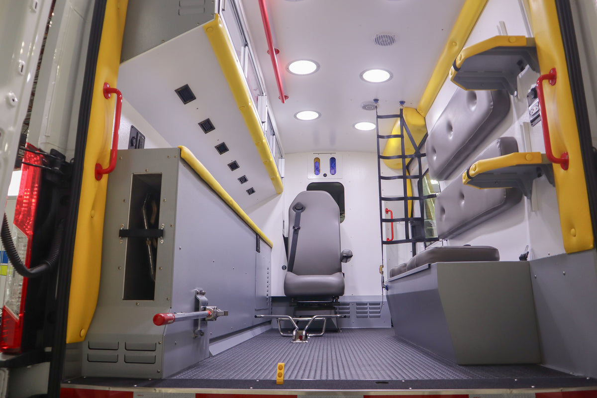 Interior of a medical vehicle with equipment and seats