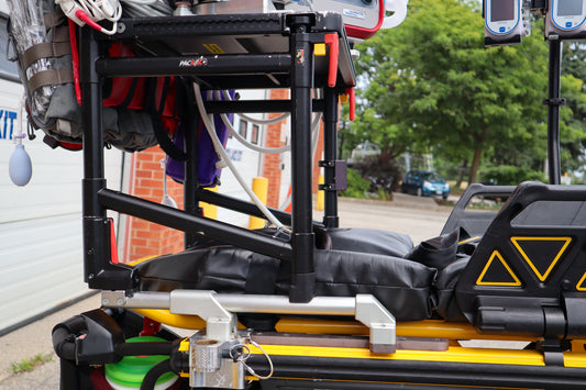 Rowland Emergency's Ferno PacRac+ mounting system and adaptor rails on a Stryker Power-PRO XT stretcher.