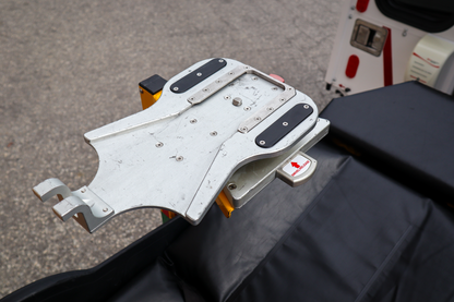 Top-down of a Rowland Emergency critical care pole with a Ferno D360 adaptor and CardioHelp mounting system attached to the pole system.