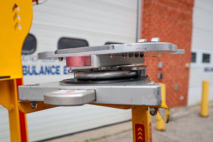 Close-up of a Rowland Emergency critical care pole with a Ferno D360 adaptor and CardioHelp mounting system attached to the pole system.