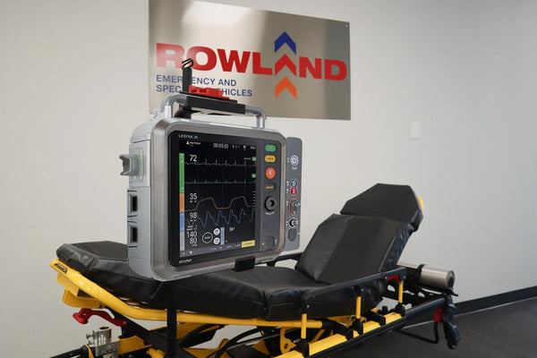 Stryker LIFEPAK 35 mounted on a stretcher system by Rowland Emergency, designed for secure and efficient integration of critical care equipment.